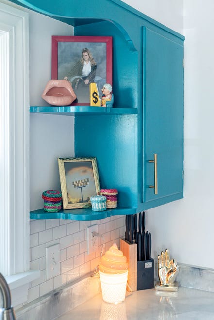 The kitchen shelves are filled with sentimental photos and other mementos at this home in Louisville's Fern Creek area.