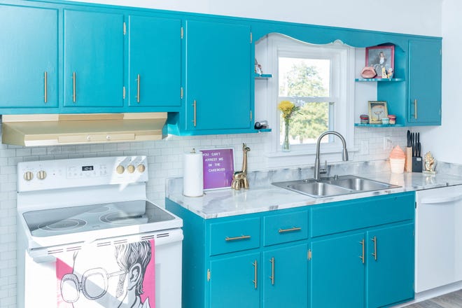 The resin kitchen countertops were built by the homeowner at this home in Louisville's Fern Creek area.