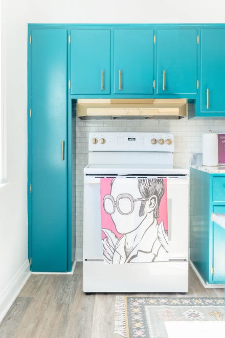 The stove knobs were painted to match the hood and cabinet fixtures at this home in Louisville's Fern Creek area.