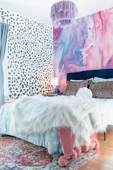 The guest bedroom boasts a variety of colors and prints at this home in Louisville's Fern Creek area.