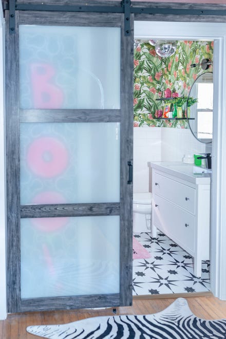 A barn door was installed in the bathroom to better utilize the space at this home in Louisville's Fern Creek area.