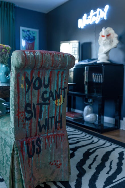 This dining room chair features a “Mean Girls” reference at this home in Louisville's Fern Creek area.