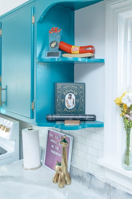 The kitchen shelves are filled with sentimental mementos, including a high school trophy at this home in Louisville's Fern Creek area.