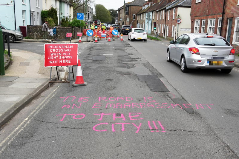 Graffiti seen in Chichester on Saturday, April 6, urging West Sussex County Council to fix several large potholes