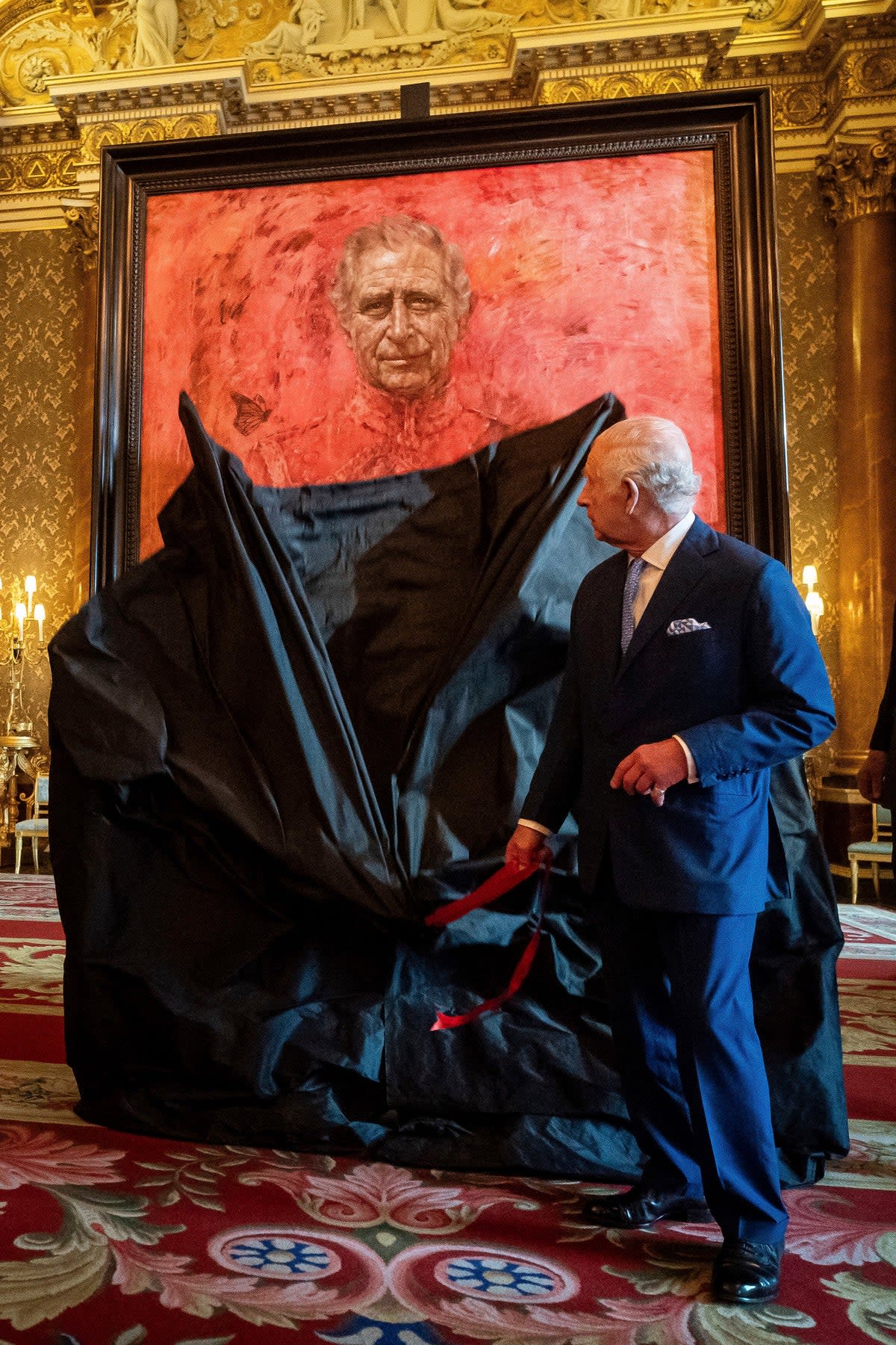 King Charles III unveils artist Jonathan Yeo's portrait of the monarch in the blue drawing room at Buckingham Palace (PA)